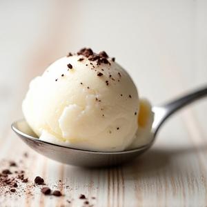 Creamy white stracciatella gelato with dark chocolate shards